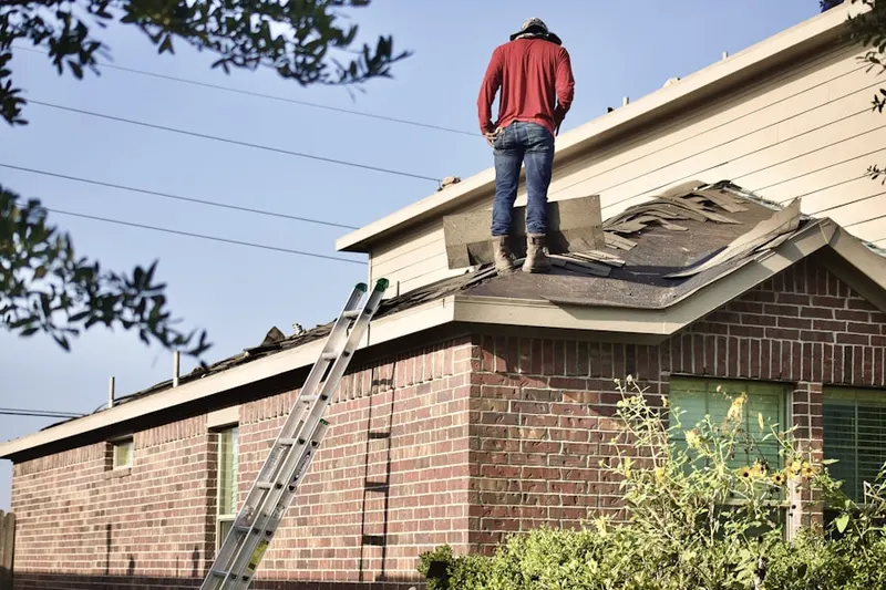 Professional roofer working on a residential roof in Lake Port Meadows